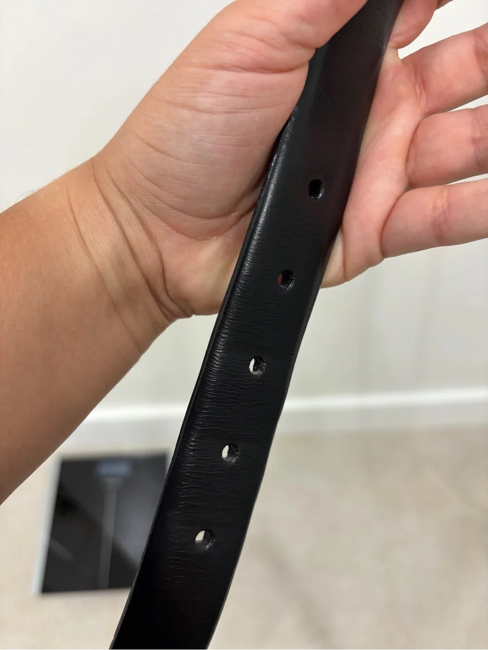 Men’s black leather belt with silver buckle